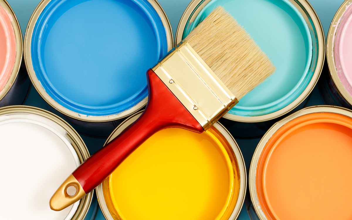 Paint cans and paint brushes and how to choose the perfect interior paint color and good for health