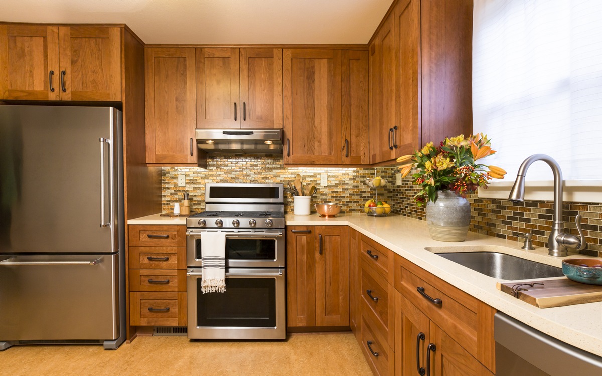 Contemporary upscale kitchen with wood cabinets and stainless steel appliances